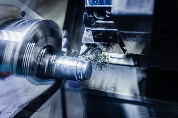 Close up of CNC machine cutting metal.