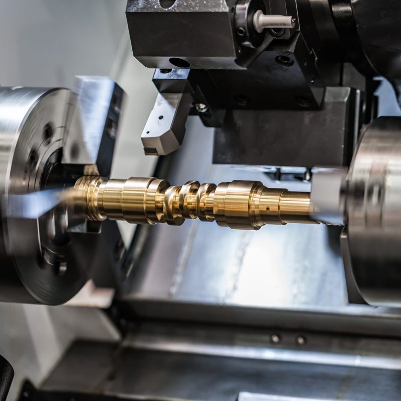 Metalworking CNC milling lathe machine. Cutting metal modern processing technology. Small depth of field. Warning - authentic shooting in challenging conditions. A little bit grain and maybe blurred.